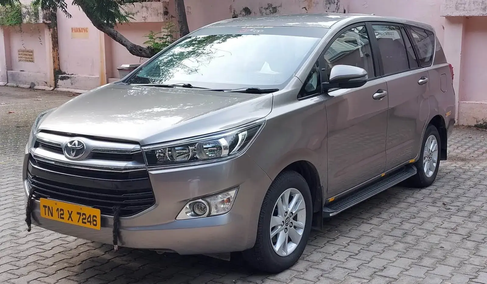 Grey Innova Crysta with yellow taxi number plate – licensed tourist vehicle in Chennai