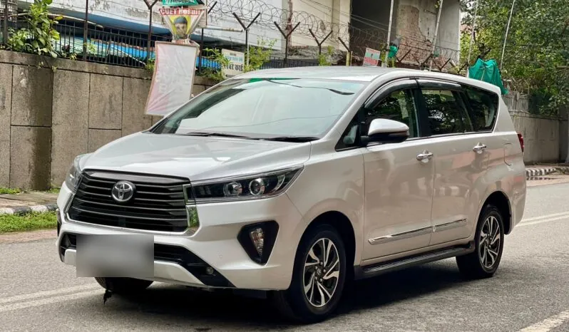 Front-angle view of a white Toyota Innova Crysta used for chauffeur-driven rentals in Chennai