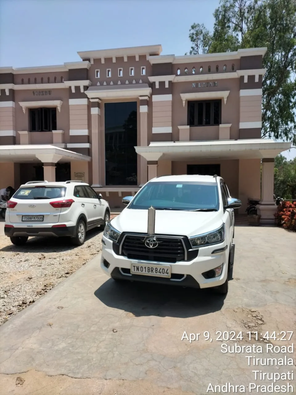 White Innova Crysta at Tirumala during a Chennai to Tirupati darshan trip