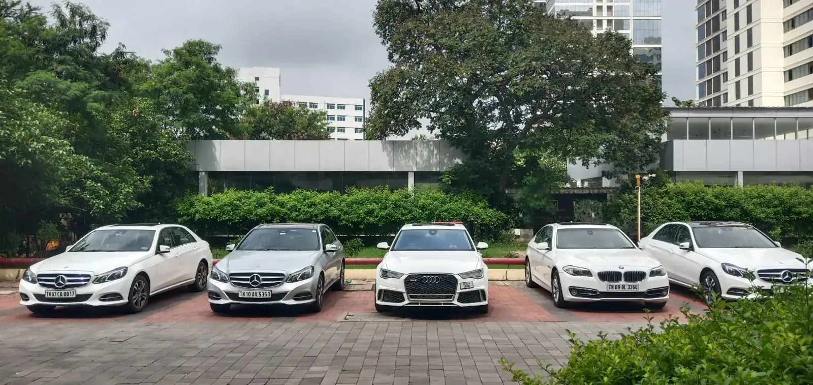 Mercedes-Benz E-Class, Audi and BMW 5 Series cars lined up for a corporate event in Chennai