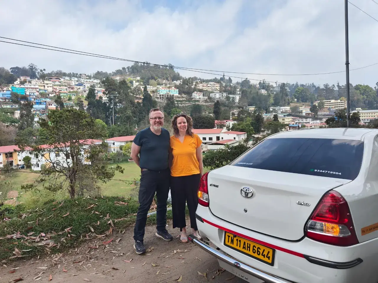 Foreign tourists on an Ooty hill-station trip with a Sri Meenakshi Travels cab