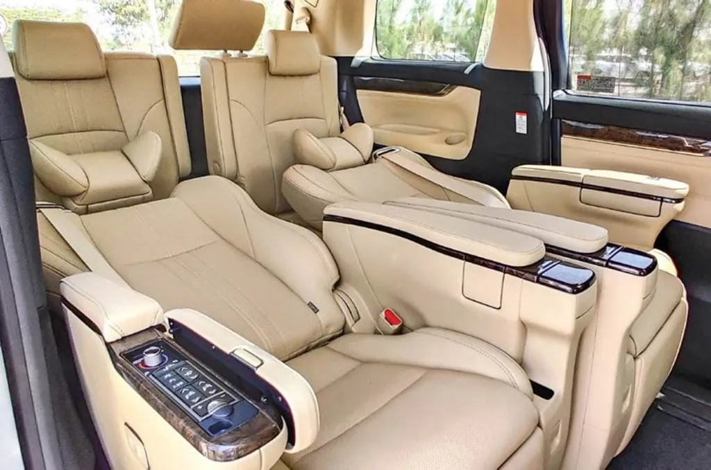 Toyota Vellfire interior with reclining captain seats and ottoman leg rests