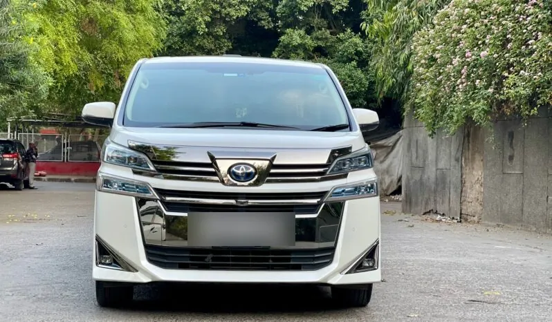 White Toyota Vellfire front view with chrome grille