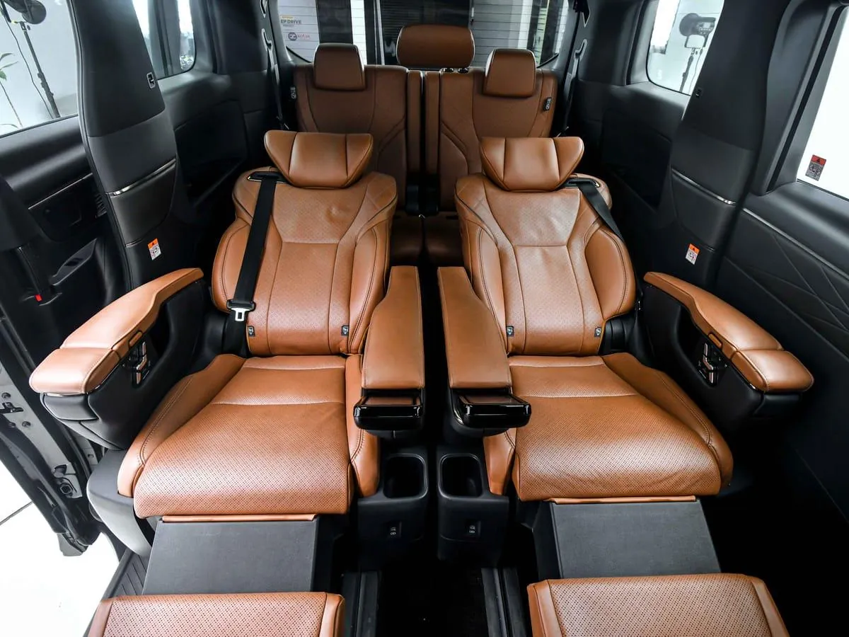 Tan leather captain seats inside a Toyota Vellfire luxury MPV